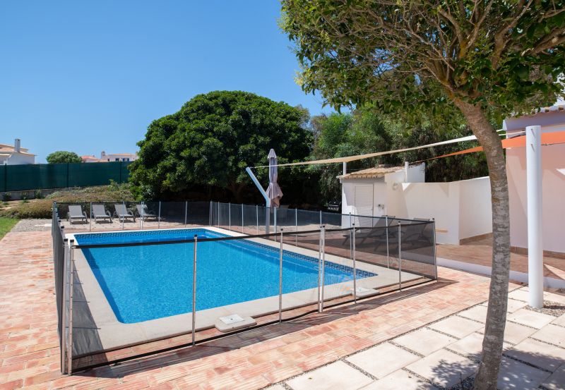 Family Using Pool with Fence